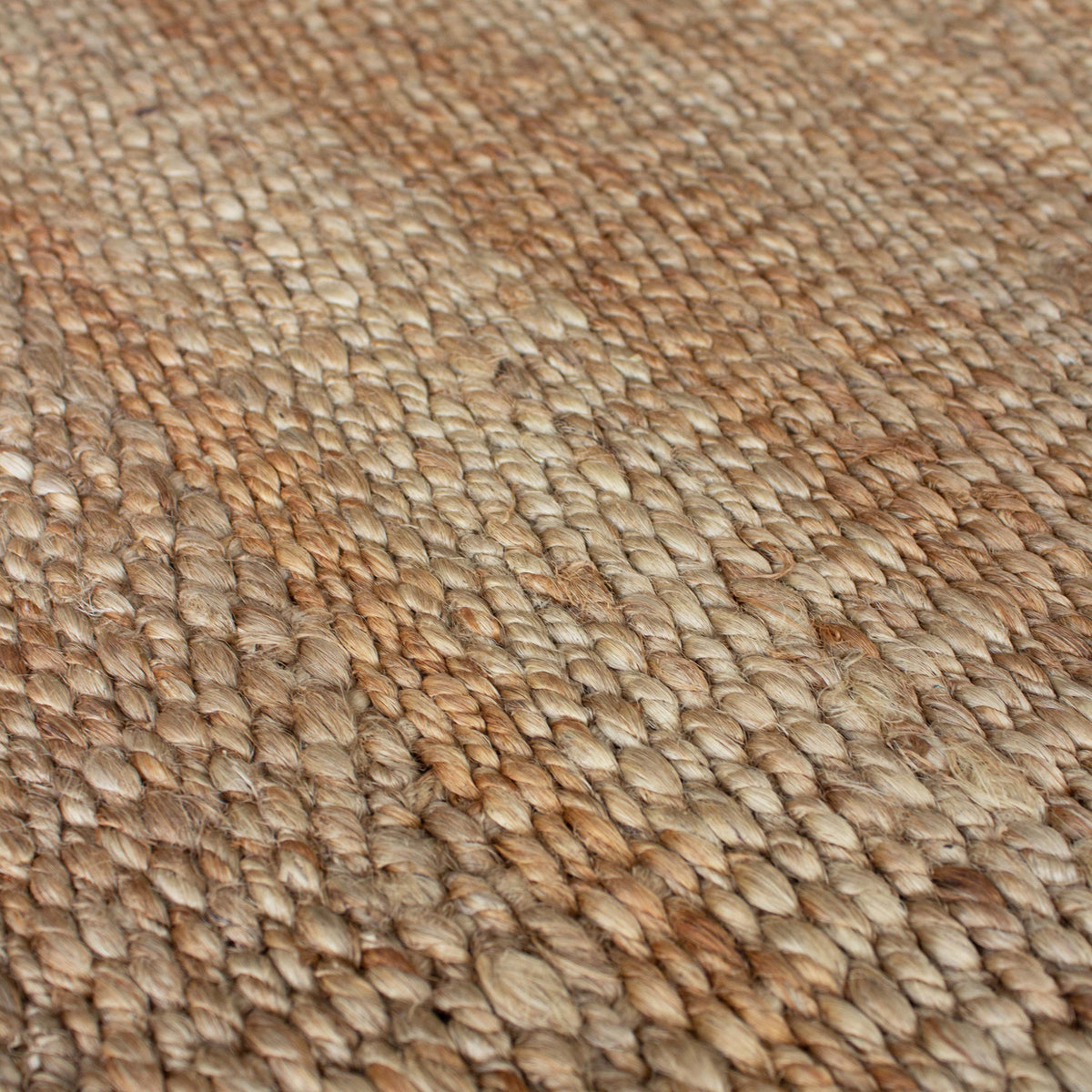 Close view of the chunky braided jute weave in warm natural tones