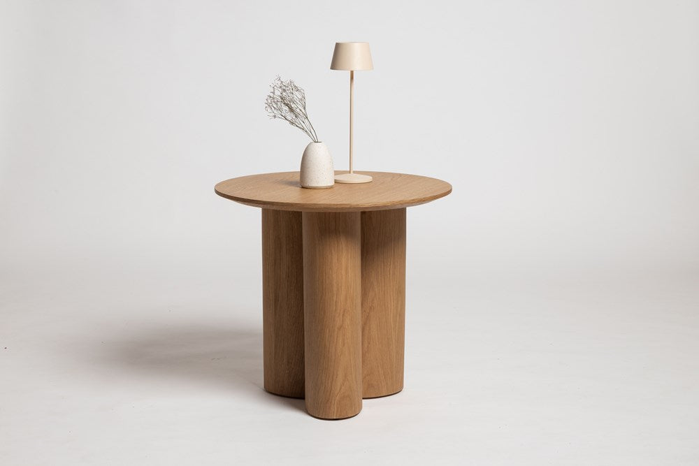 Round Side Table paired with a curved armchair