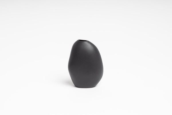 An organic seed-like shapes Harmie Vase - Stone Black handcrafted by Vietnamese Artisans, offered by Ned Collections.