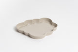 A Ned Collections Cloud Jewellery Tray, an organic piece for easy displaying, placed on a white surface.