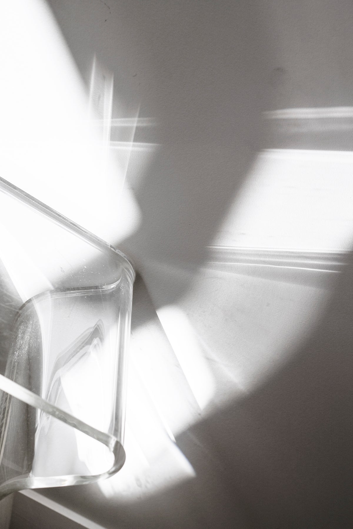 Close up of light and shadow through the clear acrylic of the Magino stool