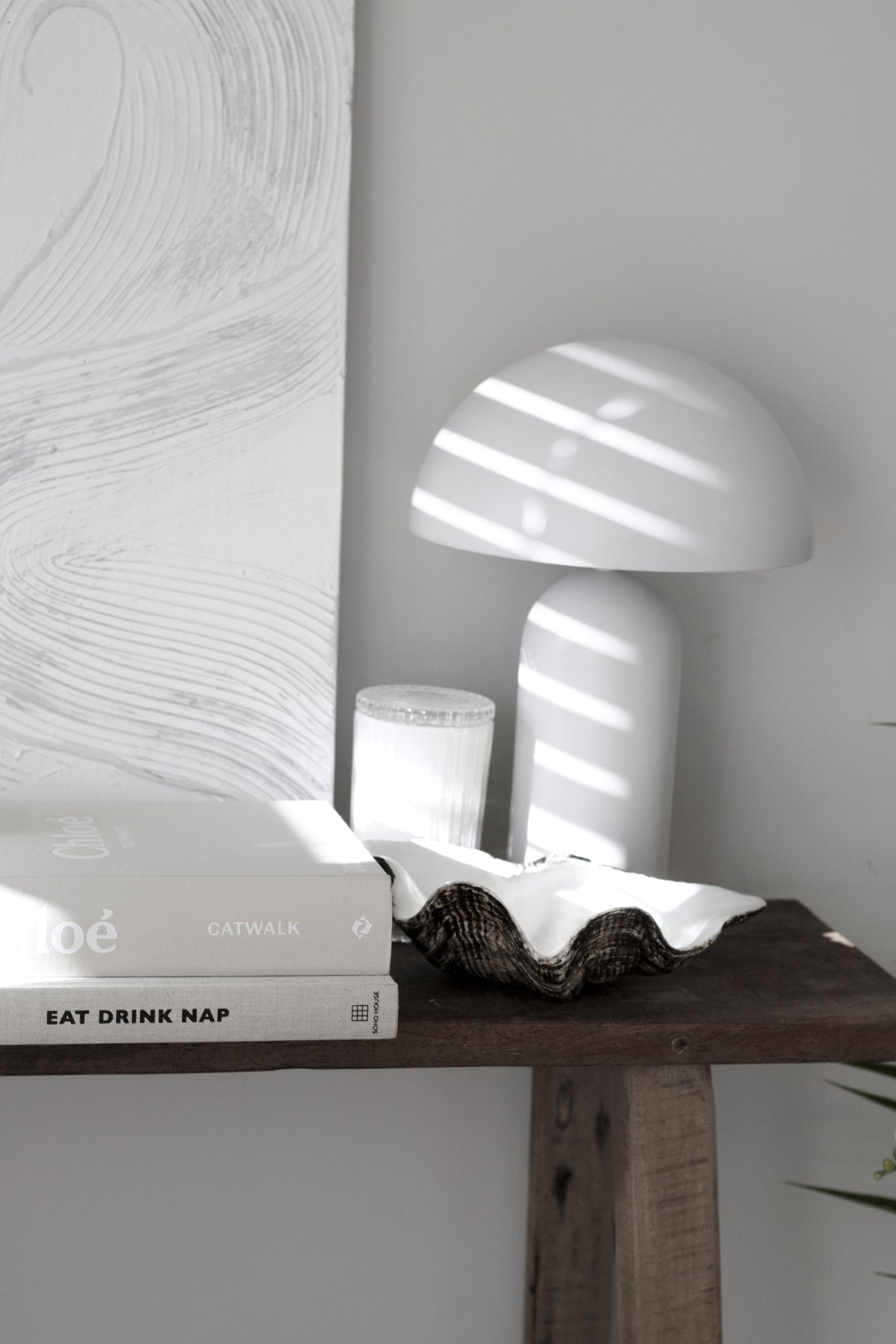 Resin clam shell dish styled in a coastal interior