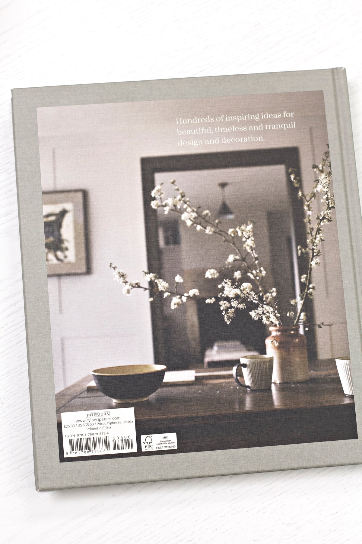 Calm interiors book page spread showing a styled room