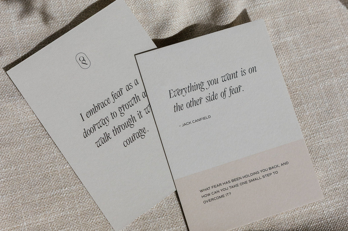 Two affirmation cards laid on a white surface