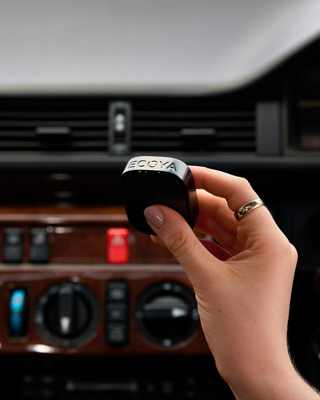 Ecoya Car Diffuser clipped onto a car vent for long-lasting interior fragrance