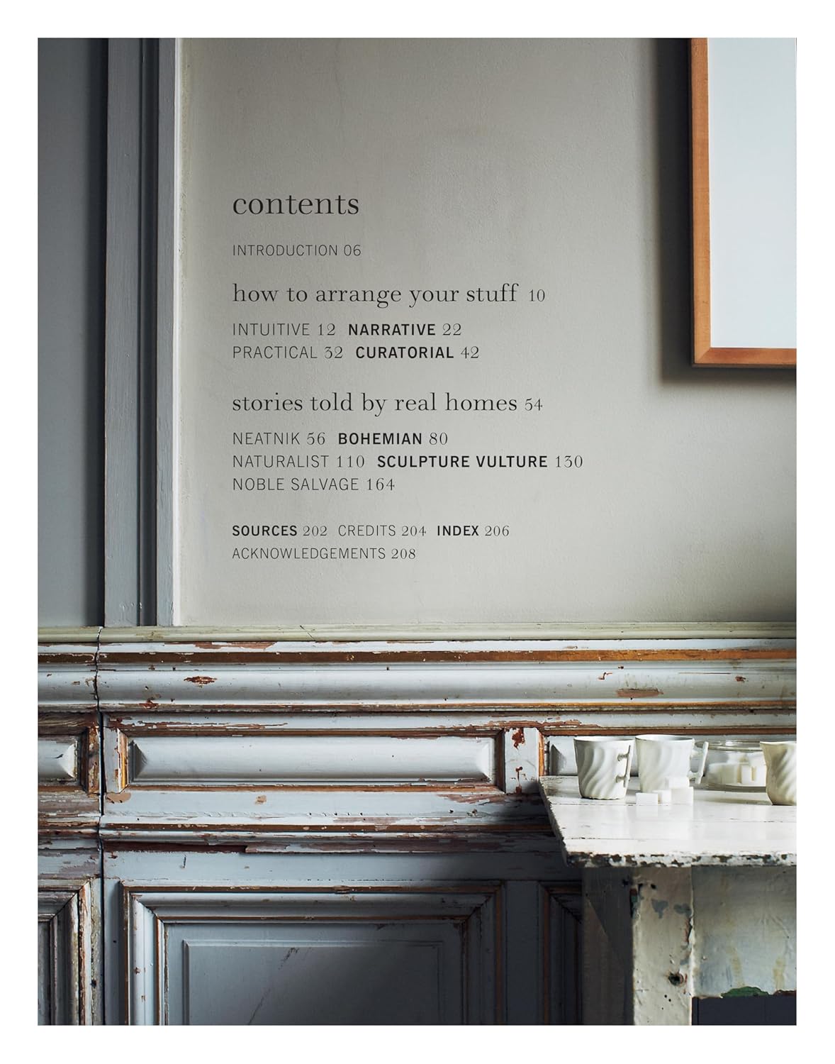 Contents page of Inside Stories over a photo of a grey panelled wall