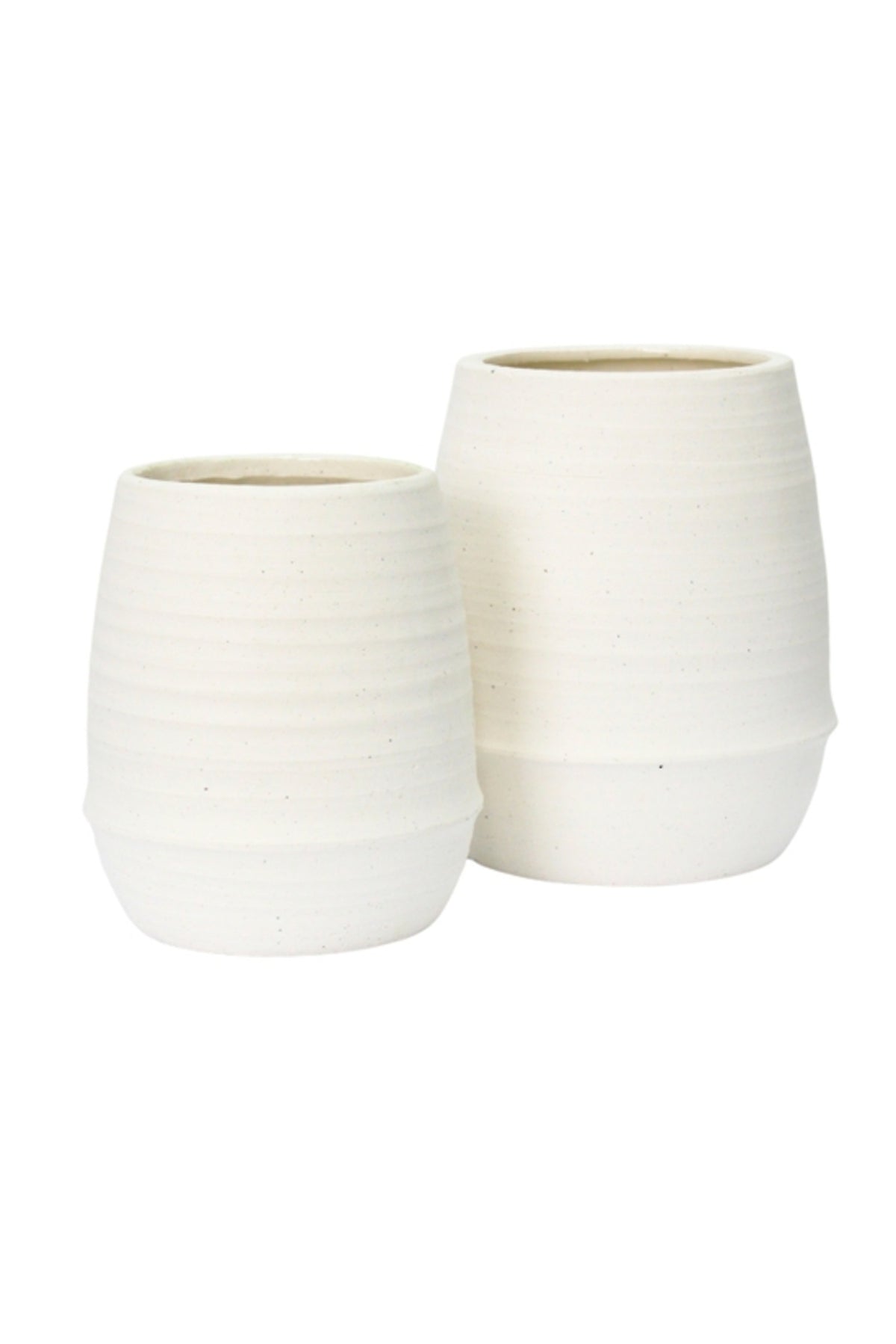 Small and medium Alma ribbed ceramic vases in chalk, grouped on a white background