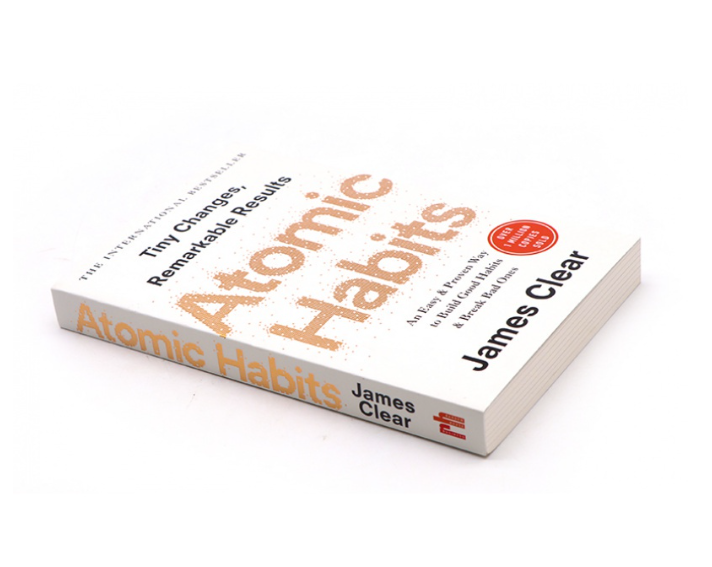 Atomic Habits by James Clear styled flatlay