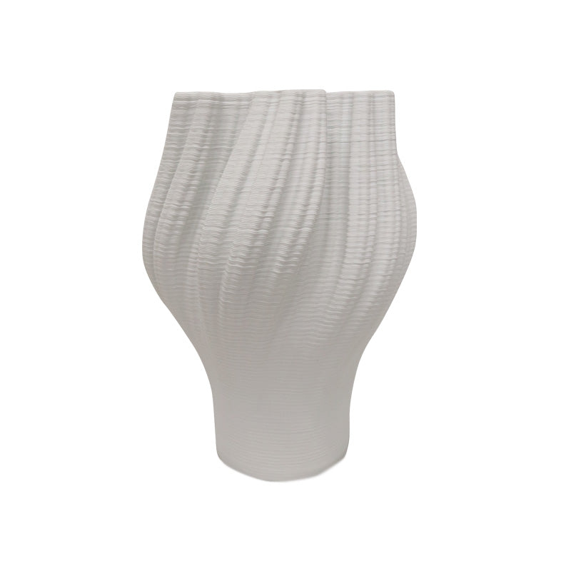 White 3D printed porcelain vase seen straight on, showing the tapered base