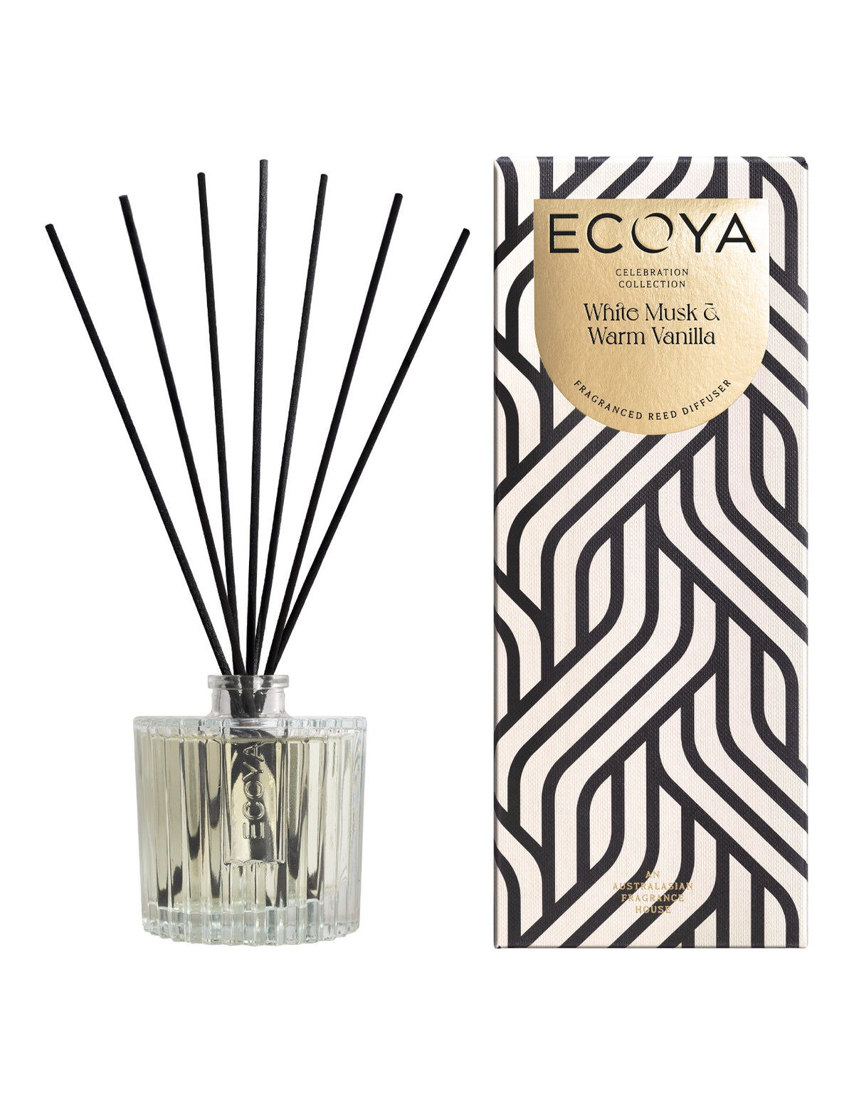 Ecoya Celebration reed diffuser with black reeds beside its black and white patterned gift box