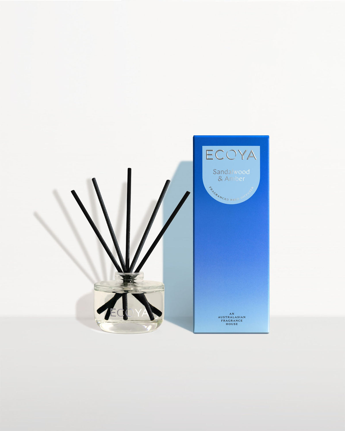 Ecoya Sandalwood and Amber mini reed diffuser 50ml in a glass bottle with rattan reeds
