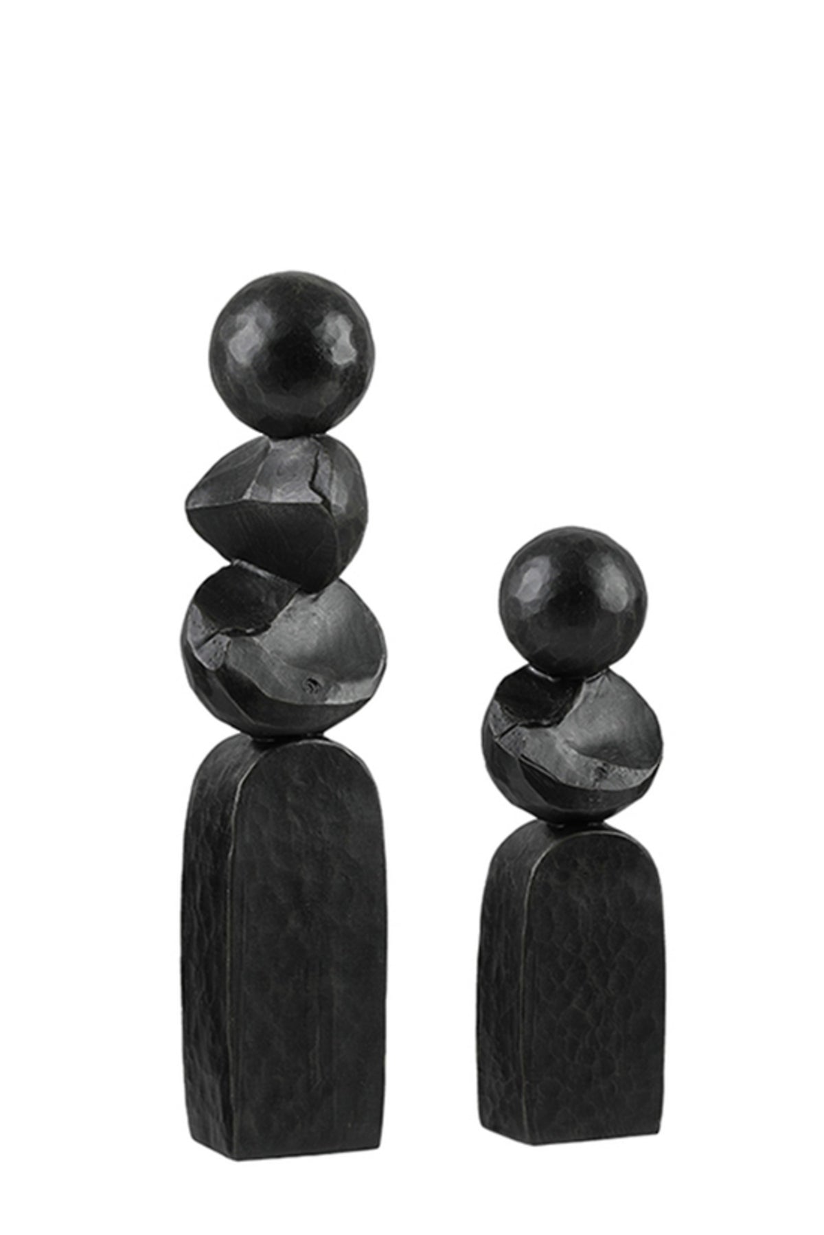 Small and large black Pillar sculptures side by side on a plain background