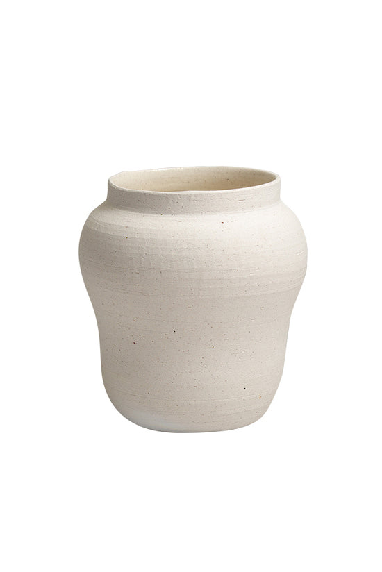 Sandface bellied pot in textured sand ceramic, plain background