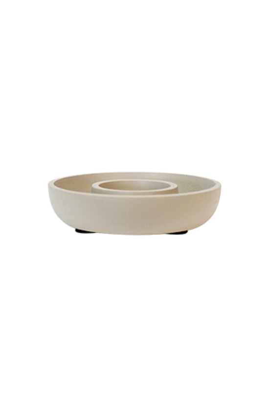 Billy tea light holder in matte beige, a low round dish with a recessed centre well, on small dark feet