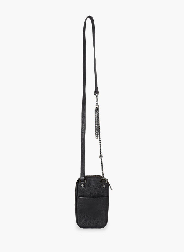 Black leather Attached To Me crossbody bag, back view with the strap and chain