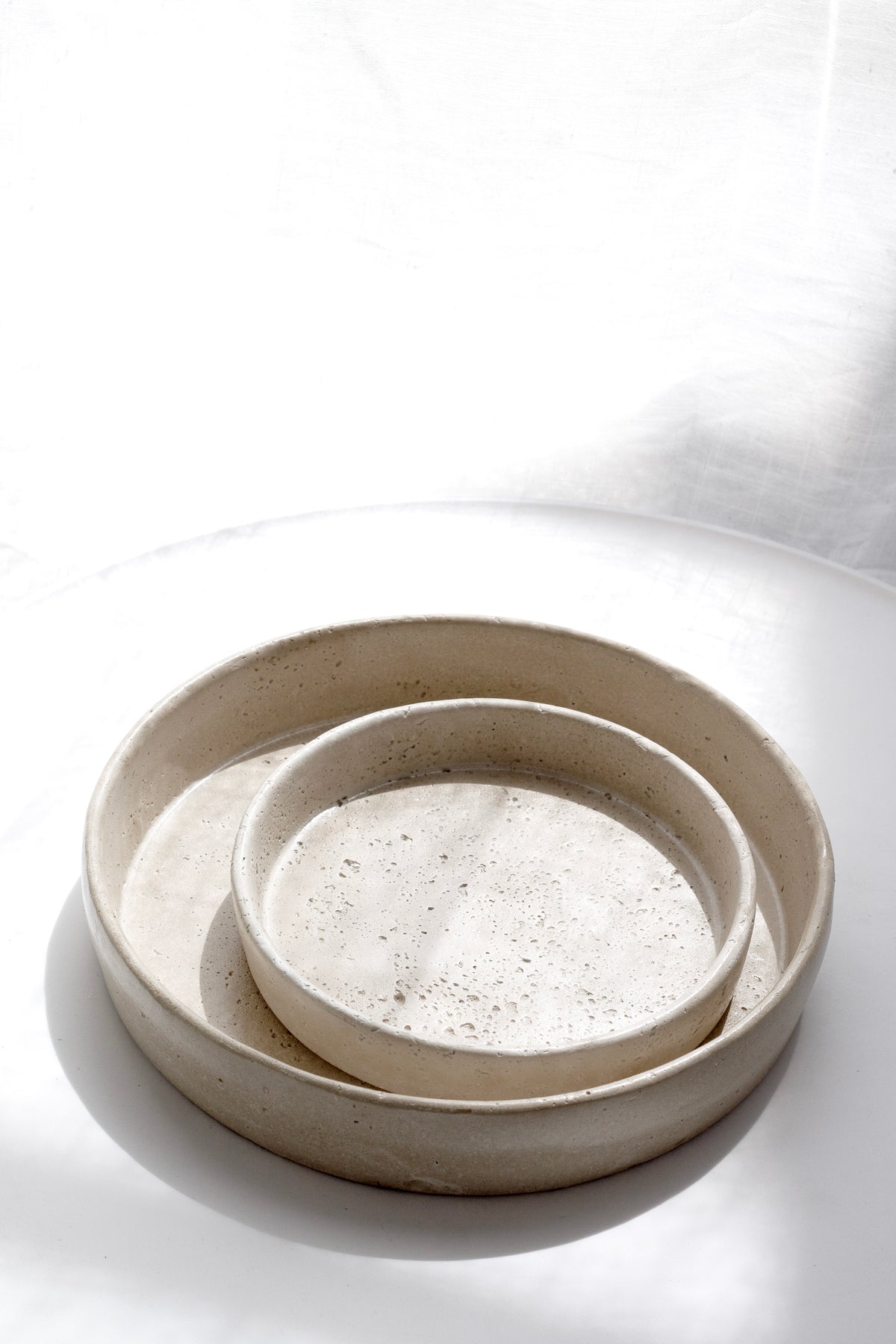 Sahara tray nested with a second tray on a white surface