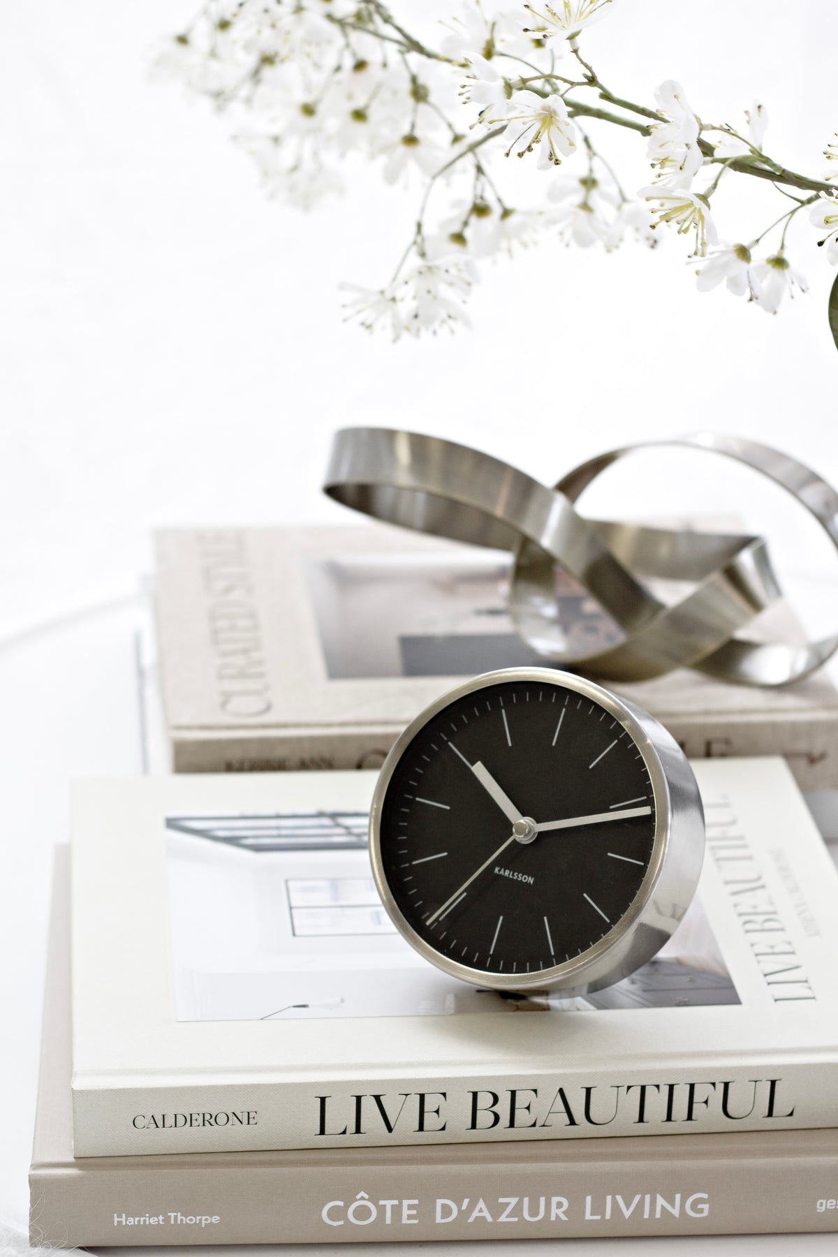 Karlsson Minimal Alarm Clock styled on a bedside surface