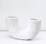 The Vases Mia Off-White Pipe Vase is a stunning 14cm cement vase with speckles on it.