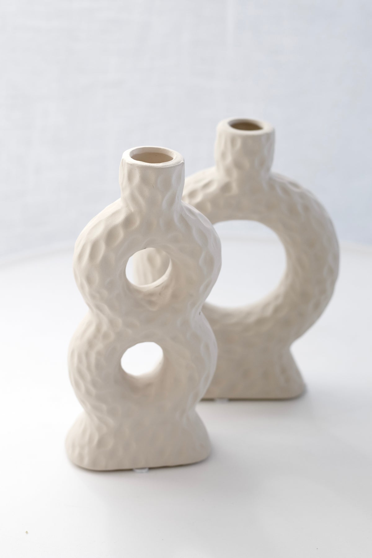 Sicily Loop Ceramic Vase in front of the Naples single loop vase