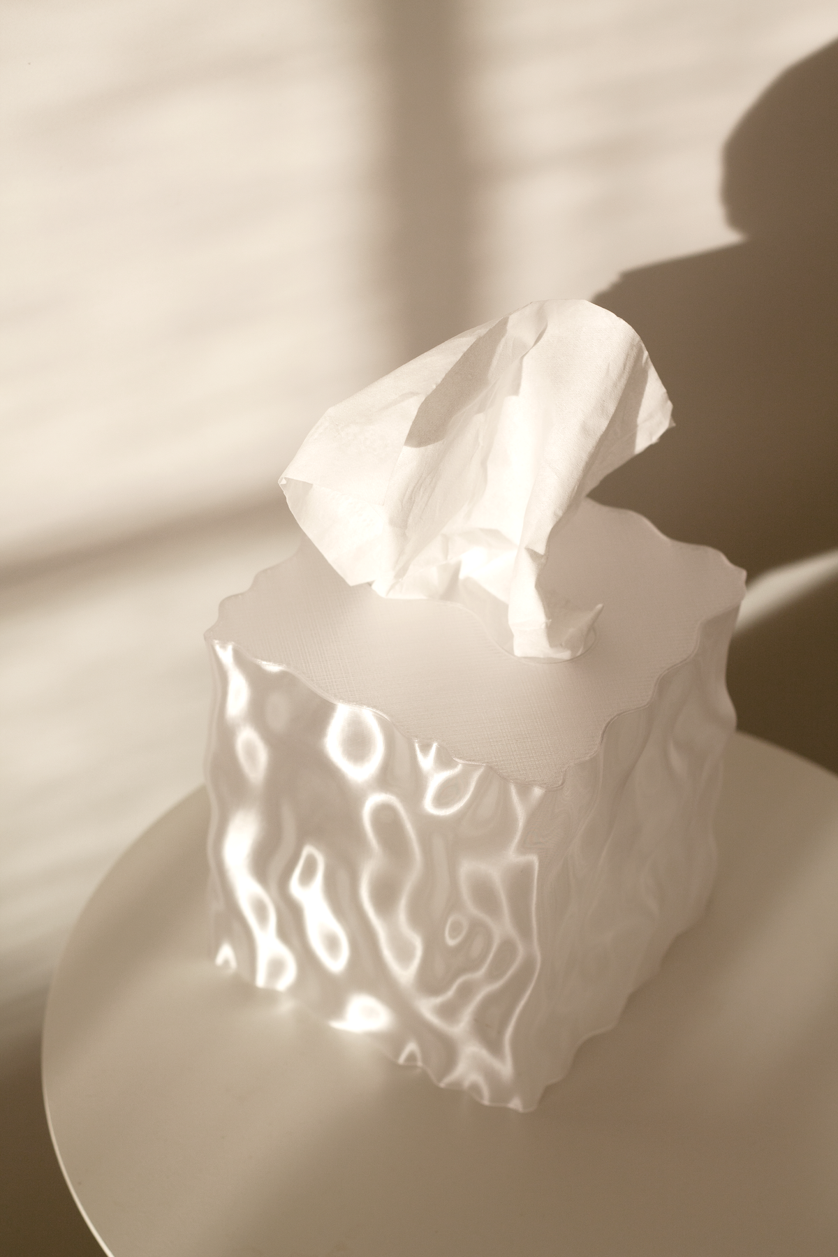 Clear Flow cover glowing in warm light on a side table