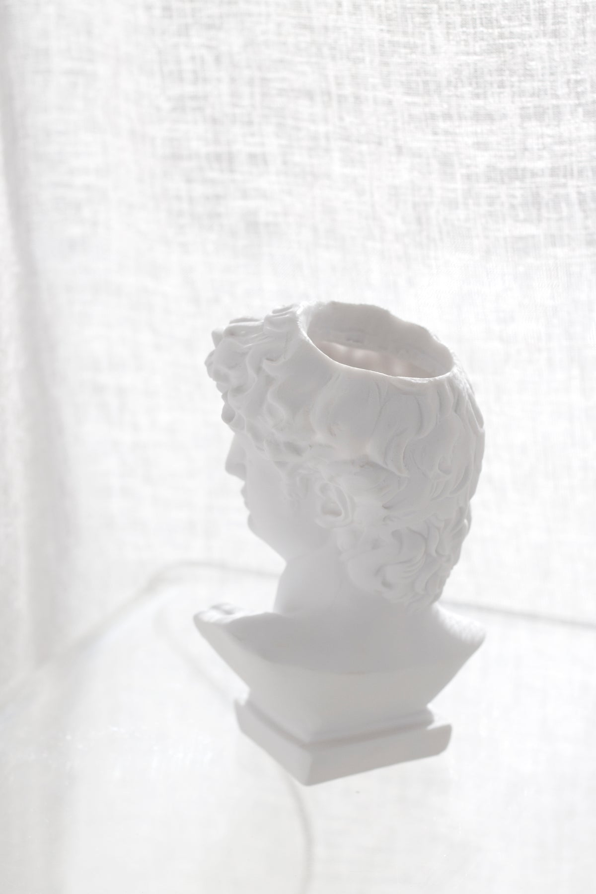 David vase turned to show the opening in the crown and the stepped plinth