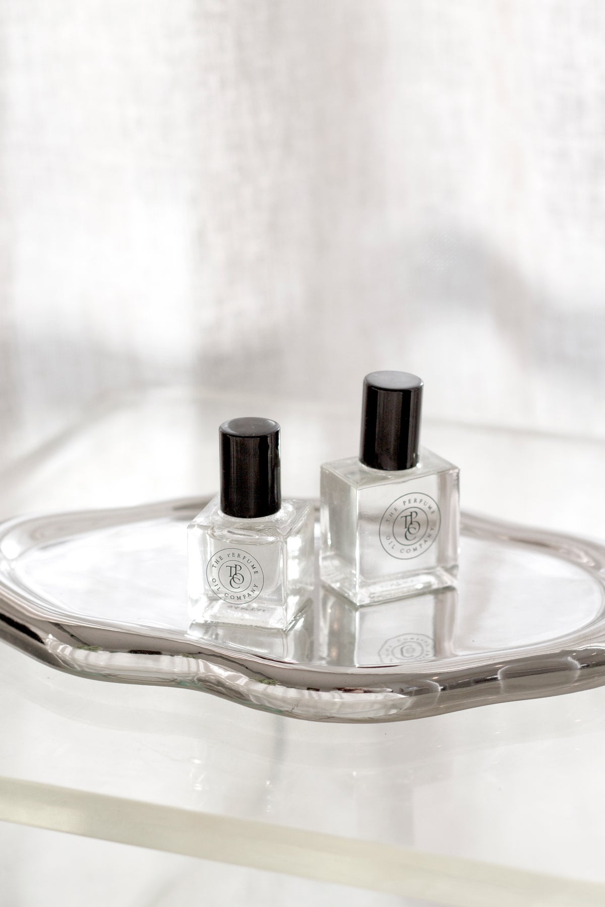 Silver Cloud Tray styled with skincare on a bathroom shelf