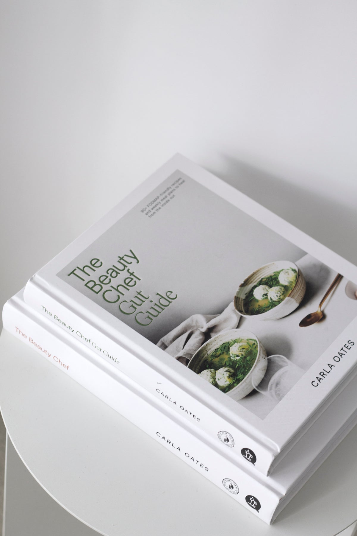 The Beauty Chef Gut Guide styled with wellness products