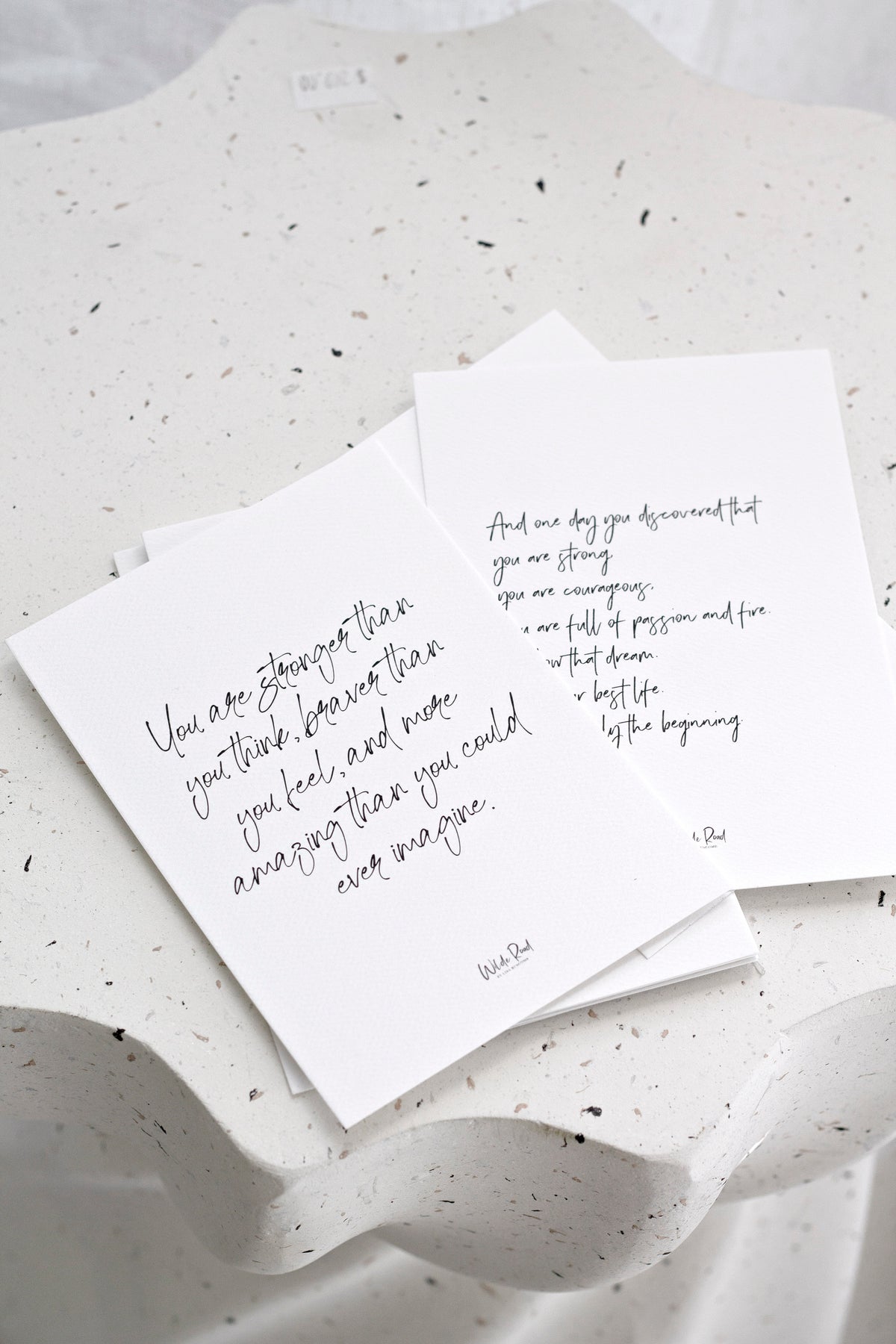 Affirmation cards scattered on soft white fabric