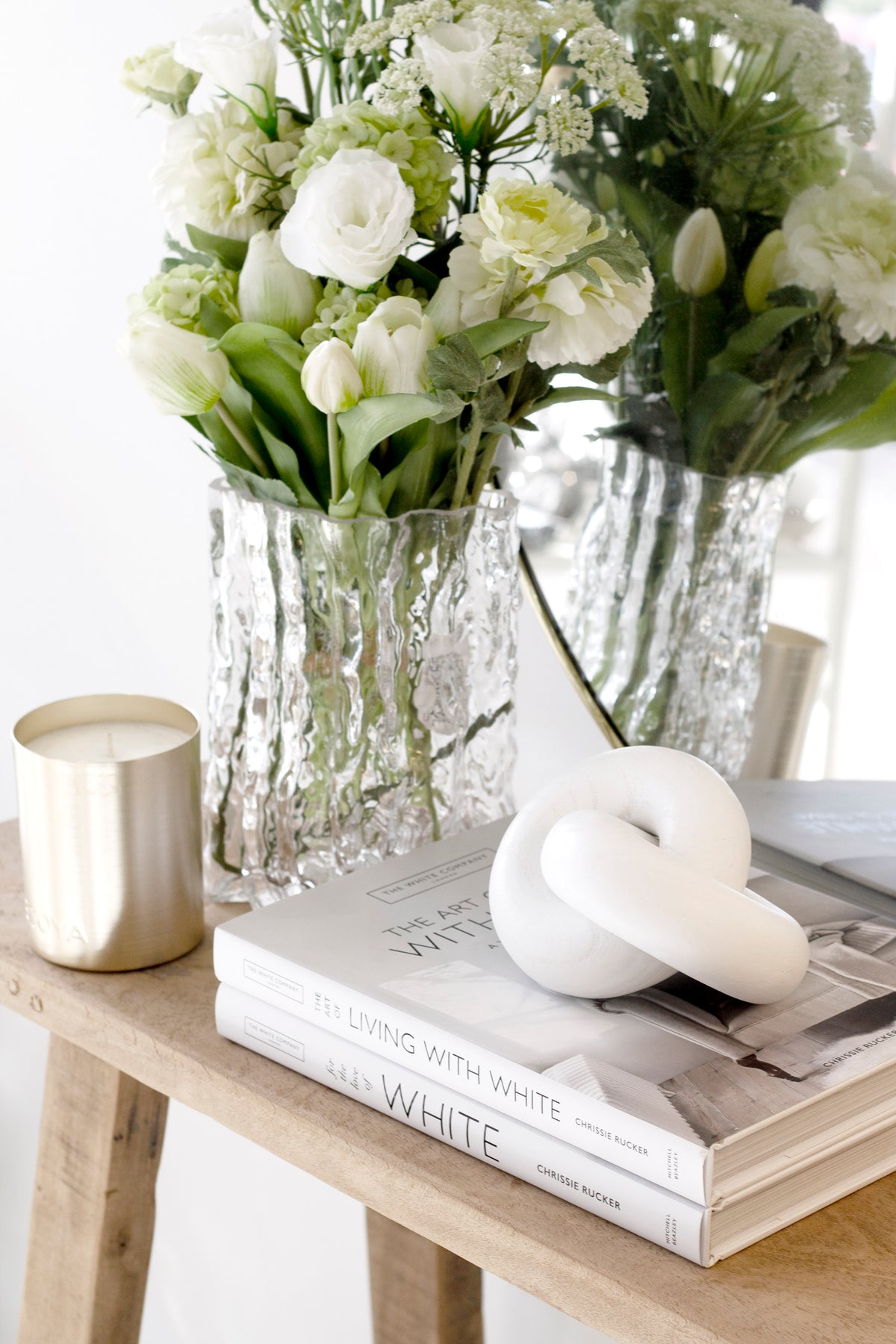 The Art of Living With White book styled with home decor