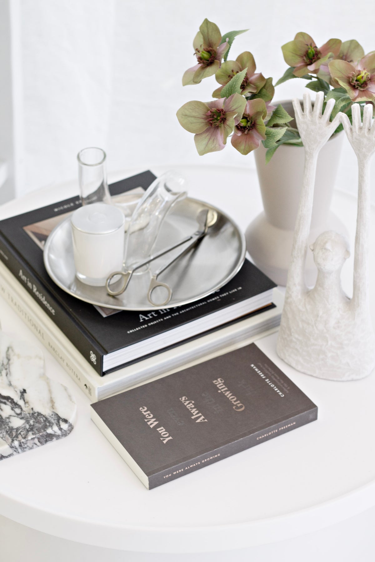 Gold round stainless steel decor tray on a dresser
