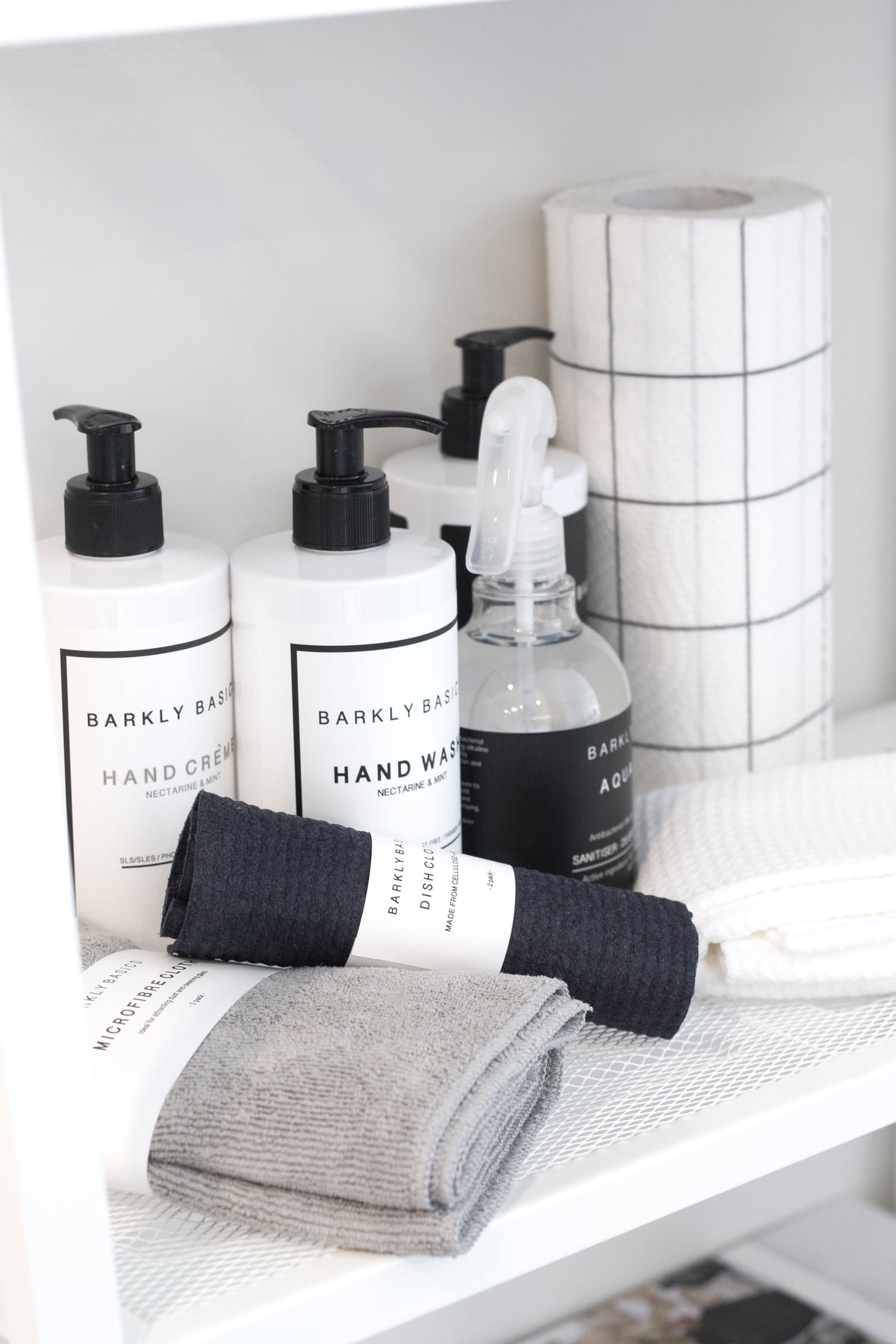 Barkly Basics Black Microfibre Tea Towel draped over an oven handle