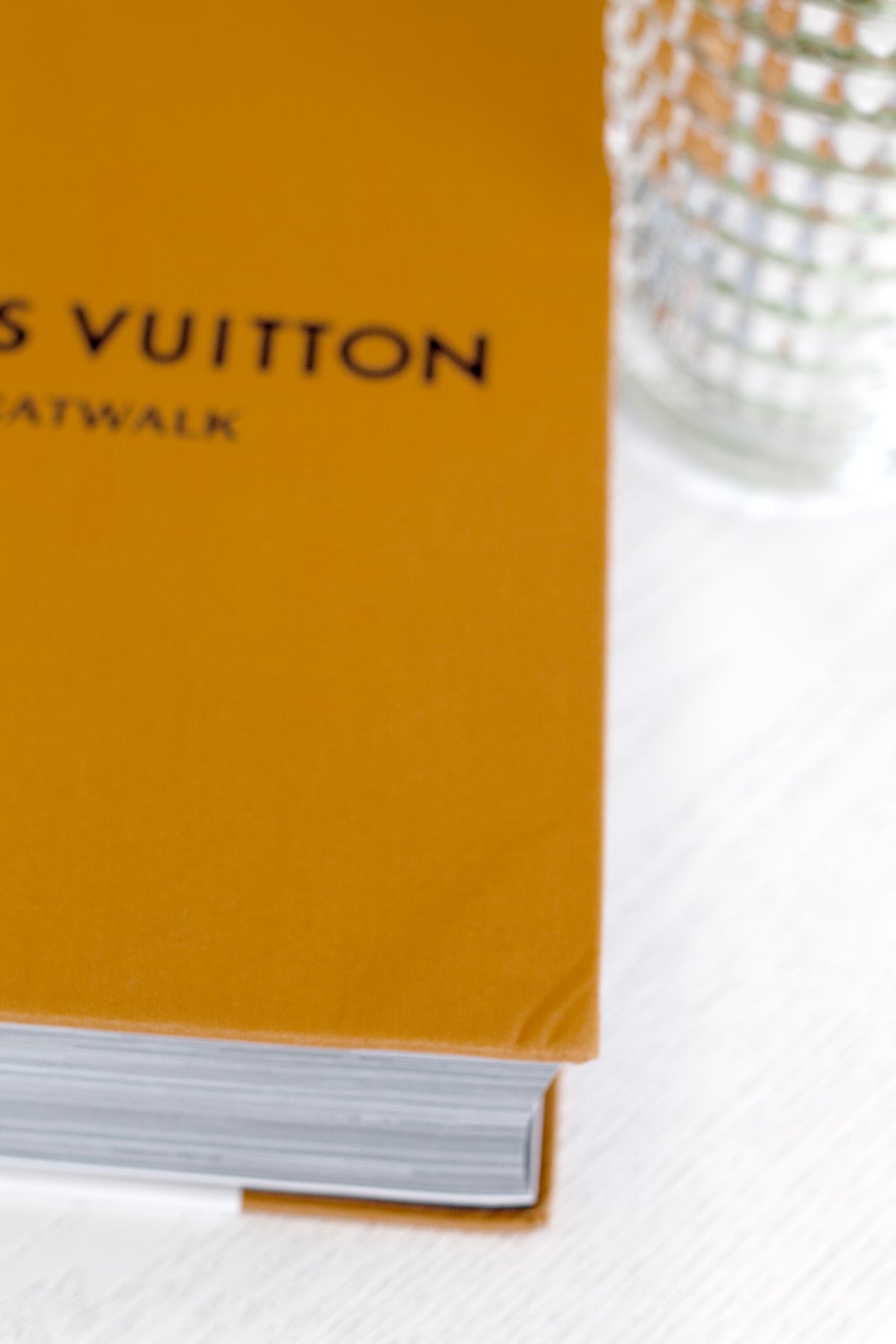 Catwalk fashion book series styled on a coffee table