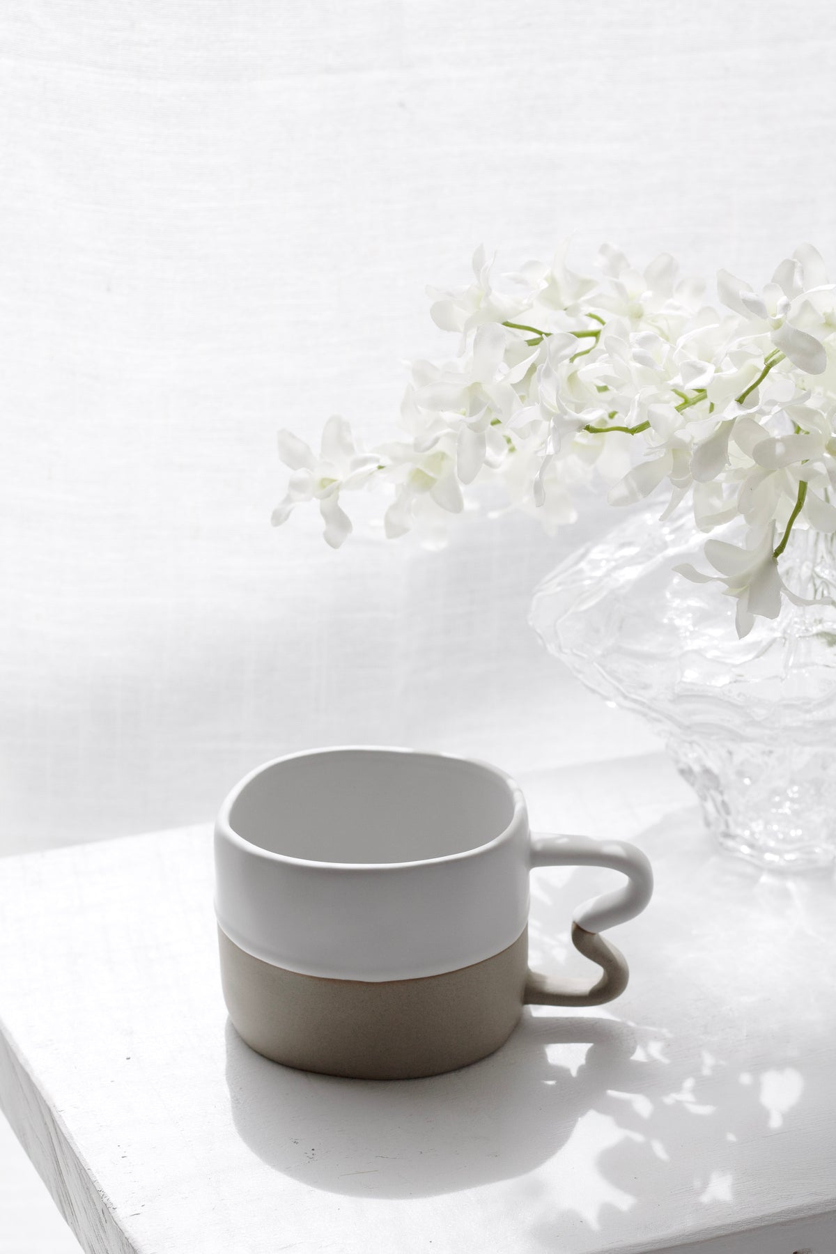 Benni Mug styled on a kitchen counter with a linen napkin