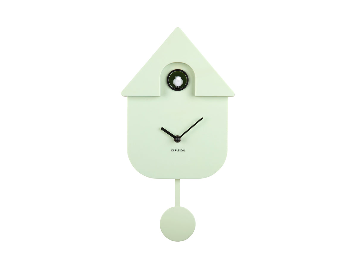 Karlsson Modern Cuckoo Clock in Soft Green, front view with pendulum on a white background