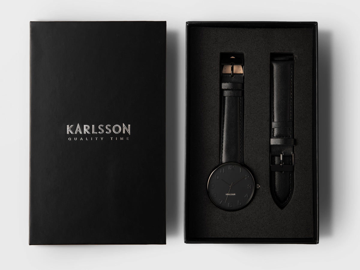 Karlsson Mr Black Steel watch in its black Karlsson presentation box with a spare leather strap