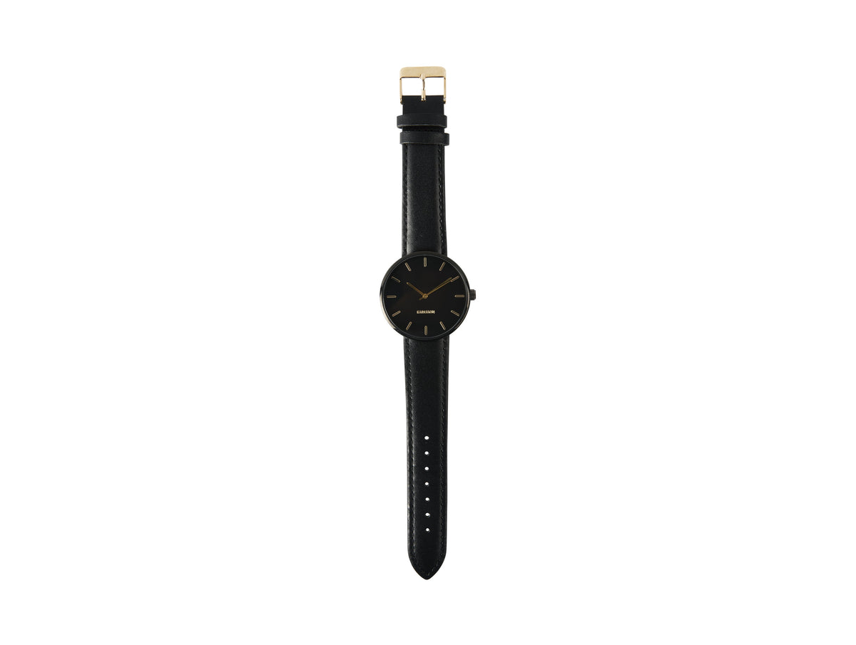 Karlsson Minimal watch in black photographed flat with the black leather strap extended
