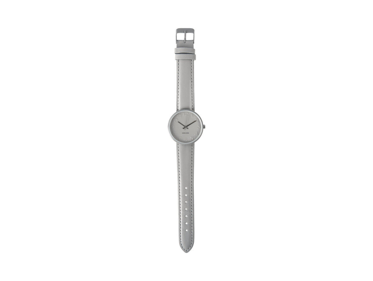Karlsson Ms Grey watch photographed flat with the grey leather strap extended