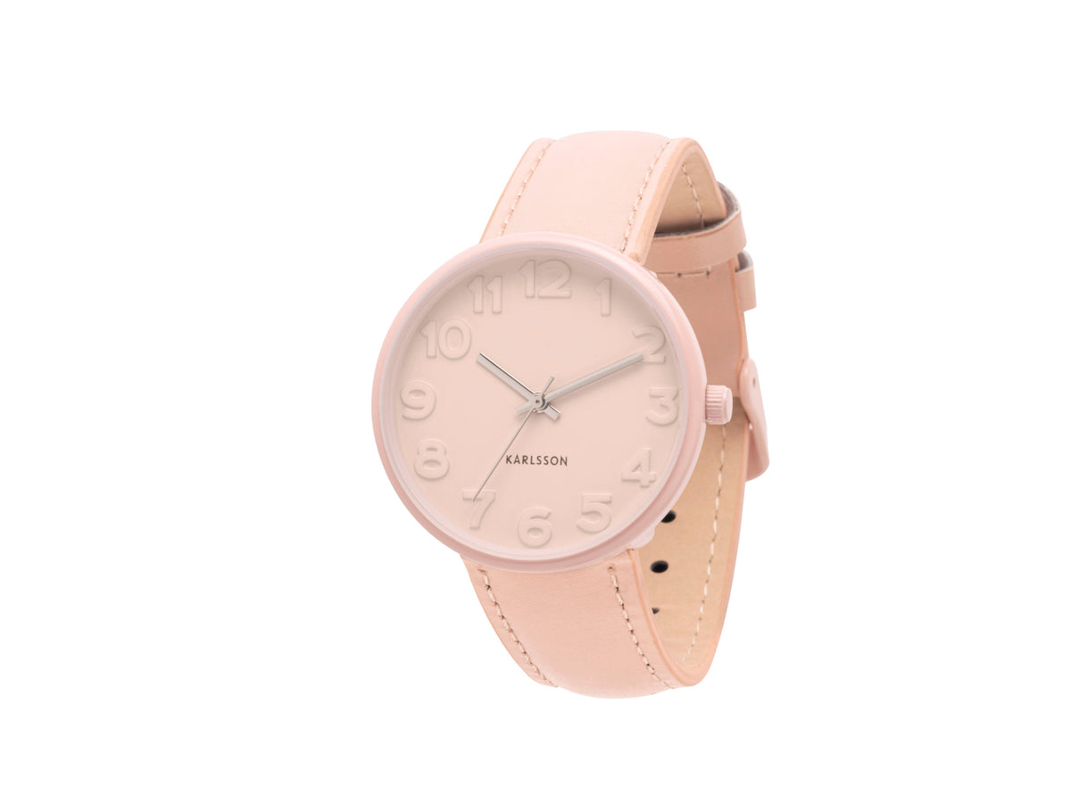 Karlsson Ms Pink watch with a blush case and pink leather strap, shown at an angle