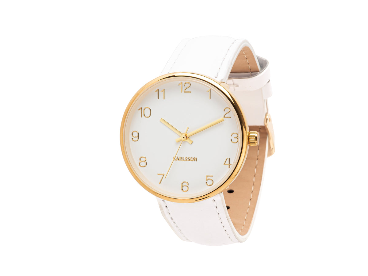 Karlsson Charm watch with a gold case and white leather strap, shown at an angle