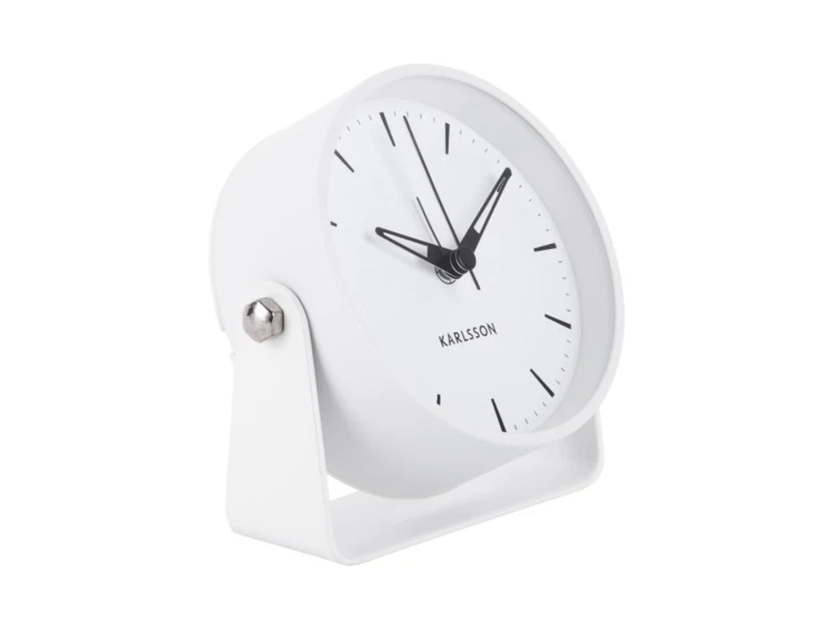 Karlsson Calm Alarm Clock in white, angled on its stand against a white background