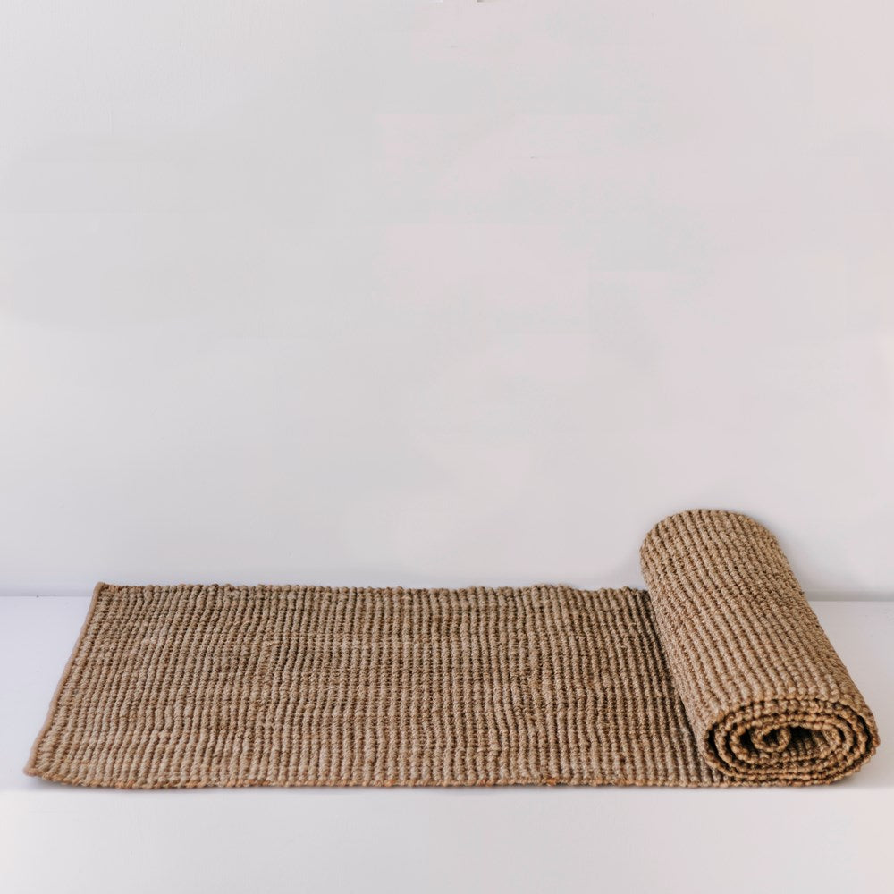 A Garcia Home Jute Runner Bubble Natural Brown 80x300cm on a white surface.
