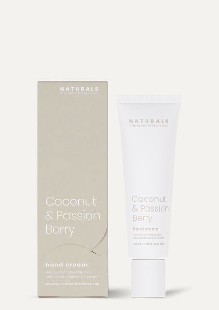 Coconut & Passion Berry hand cream tube and sand coloured box standing on a pale background