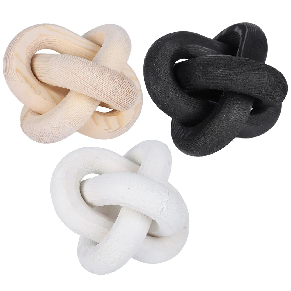 The knot ornament in all three colours together: natural wood, black and white