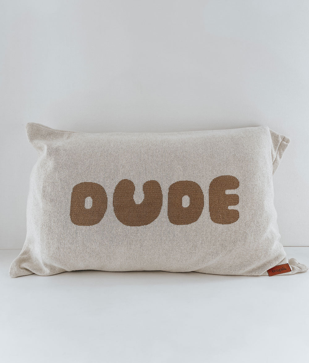 DUDE kids jersey cotton pillowcase in natural with sand lettering and a small leather label on a white backdrop