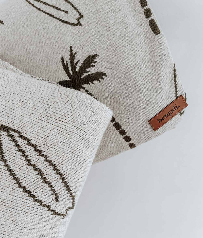 A SURFING PALM BLANKET with palm trees and palm trees on it. (Brand: Bengali Collections)