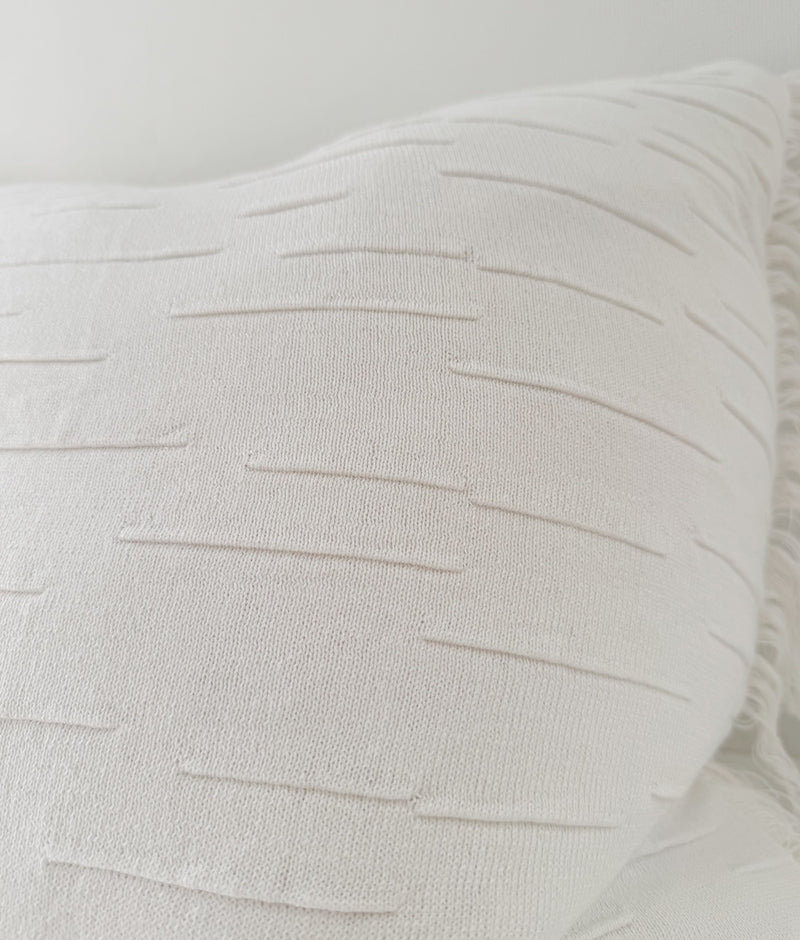 Close-up of the raised dashed texture on the Ivory Flurry cotton cushion cover