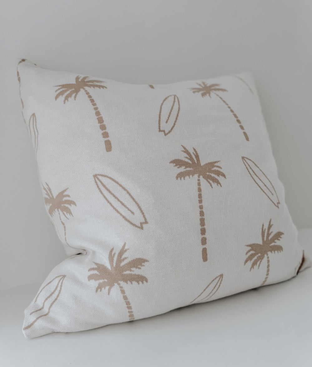 Ivory euro pillowcase printed with natural palm trees and surfboards, side angle