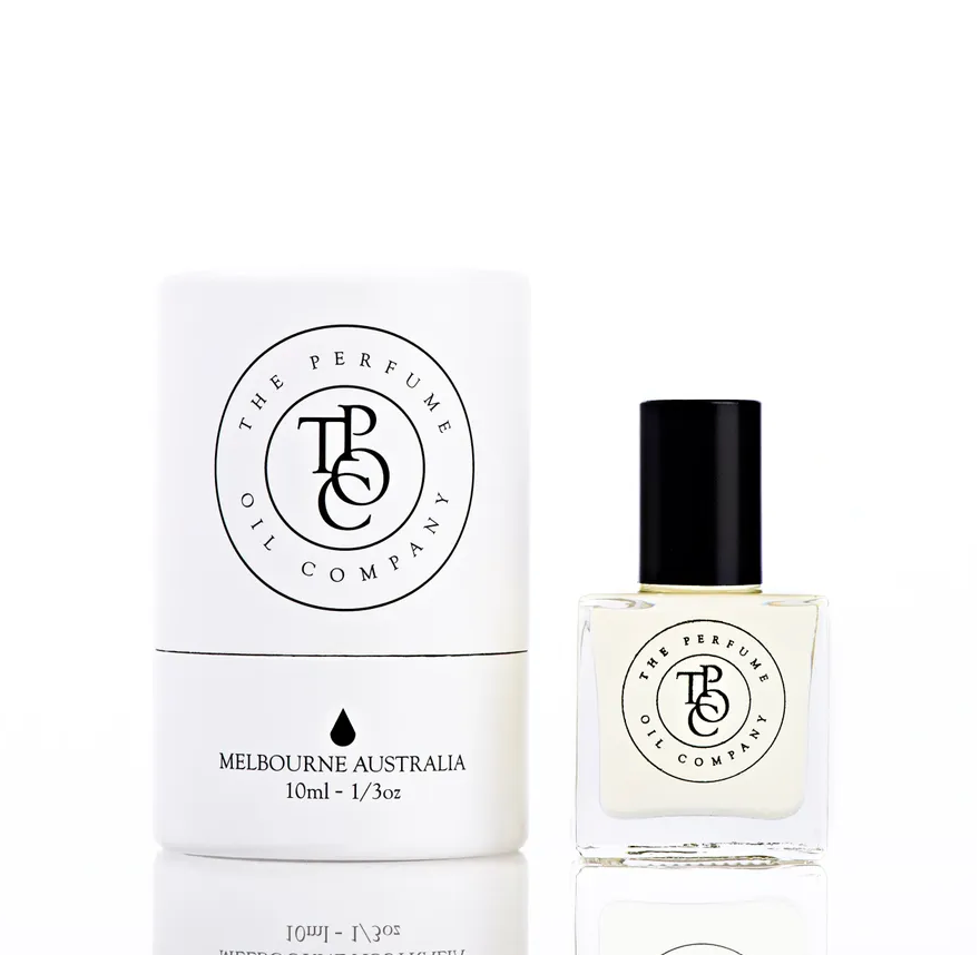 A MIDNIGHT cologne bottle inspired by Dark Rum (Malin+Goetz) next to a white box.