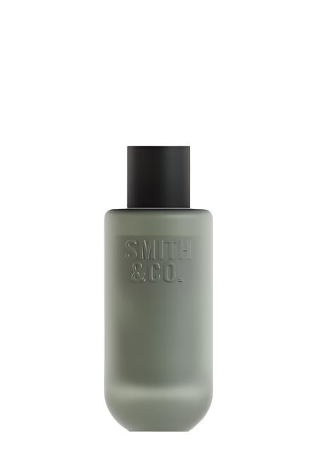 Smith & Co. room spray in a sage green matte bottle with a black cap, on a white background