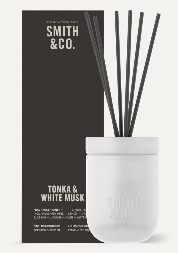 Smith and Co Tonka and White Musk diffuser in front of its dark gift box